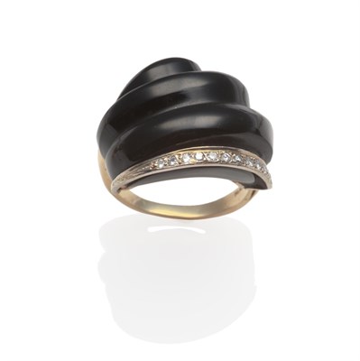 Lot 2142 - An Art Deco Style Black Onyx and Diamond Cocktail Ring, the curved stepped onyx above a band of...