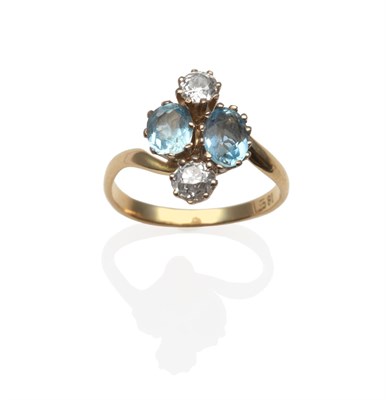 Lot 2157 - An Aquamarine and Diamond Cluster Ring, with two oval cut aquamarines flanked by two old cut...