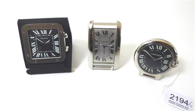 Lot 2194 - Three Alarm Travelling Timepieces, signed Cartier, circa 2010, the first, quartz movement, silvered