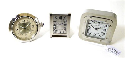 Lot 2196 - Three Travelling Timepieces, signed Cartier, circa 2010, the first, quartz movement, silvered...