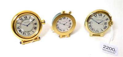 Lot 2200 - Three Alarm Travelling Timepieces, signed Cartier, circa 2010, the first, quartz movement, silvered