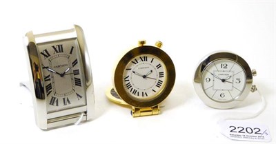 Lot 2202 - Three Alarm Travelling Timepieces, signed Cartier, circa 2010, the first, quartz movement,...