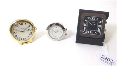 Lot 2203 - Three Alarm Travelling Timepieces, signed Cartier, circa 2010, the first, quartz movement,...