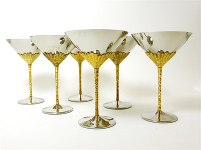 Lot 2247 - Stuart Devlin for Viners, a set of six stainless steel and gilt champagne slippers/Martini glasses