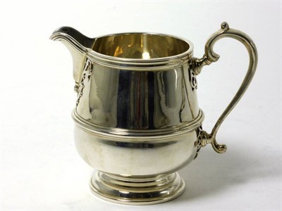 Lot 2292 - A George V Silver Cream Jug, maker's mark worn, Birmingham 1932, in the George II style with...