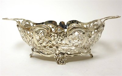 Lot 2304 - A Pierced Silver Basket, Susannah Brasted, London 1889, oval with twin handles, the sides...