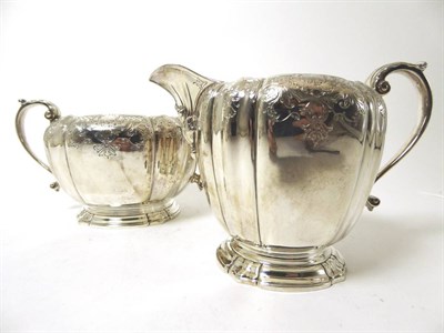 Lot 2318 - A Modern Silver Milk Jug and Sugar Bowl, Adie Brothers, London 2002, each circular with lobed sides