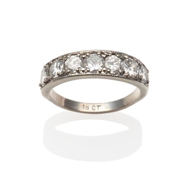 Lot 2008 - A Diamond Seven Stone Ring, round brilliant cut diamonds in white claw settings, to a plain...