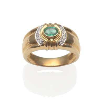 Lot 2015 - An Emerald and Diamond Ring, an oval cut emerald in a yellow rubbed over setting flanked by borders