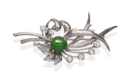 Lot 2040 - A Diamond and Jade Spray Brooch, a round cabochon jade in a white four claw setting to textured...