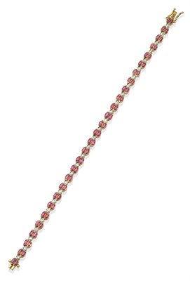 Lot 2047 - A Ruby and Diamond Bracelet, pairs of marquise cut rubies in yellow half rubbed over settings...