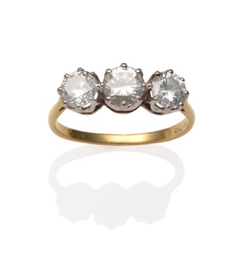 Lot 2056 - An 18 Carat Gold Diamond Three Stone Ring, three round brilliant cut diamonds in white claw...