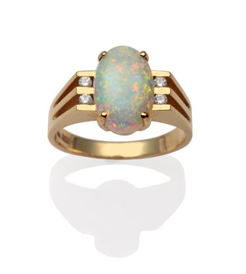 Lot 2057 - An Opal and Diamond Ring, an oval cabochon opal in a yellow four claw setting, between four...