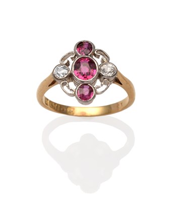 Lot 2064 - An Edwardian Ruby and Diamond Ring, an oval cut ruby between two round cut rubies and two old...