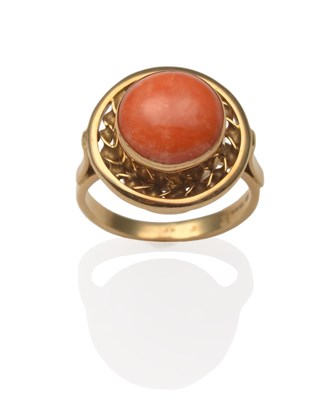 Lot 2065 - An 18 Carat Gold Coral Ring, a round cabochon coral in yellow rubbed over setting within a...