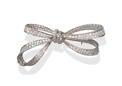 Lot 2068 - An 18 Carat White Gold Diamond Bow Brooch, pavé set with round brilliant cut diamonds, total...