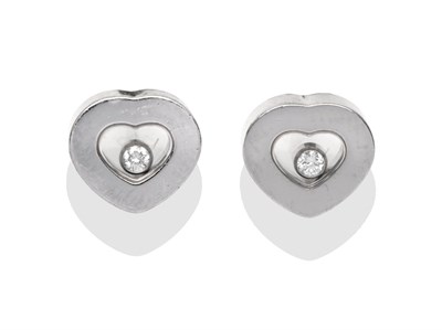 Lot 2069 - A Pair of 18 Carat White Gold 'Happy Diamond' Earrings, by Chopard, the heart shaped studs with...