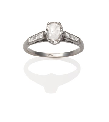 Lot 2073 - A Diamond Solitaire Ring, the old oval cut diamond in a white six claw setting, to eight-cut...