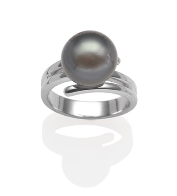 Lot 2076 - A Tahitian Cultured Pearl Ring, on a plain polished coil shank, finger size N1/2