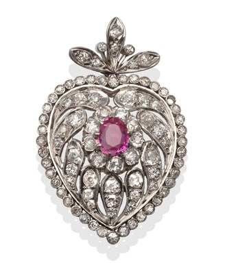 Lot 2093 - A Synthetic Ruby and Diamond Heart Shaped Pendant, the oval cut synthetic ruby within a pierced...