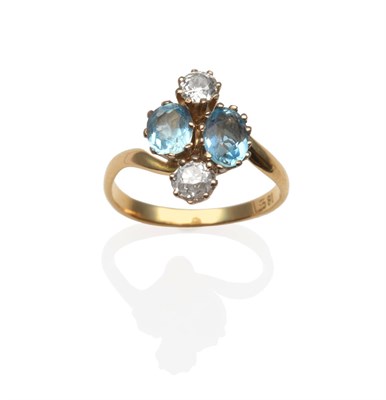 Lot 2094 - An Aquamarine and Diamond Cluster Ring, with two oval cut aquamarines flanked by two old cut...