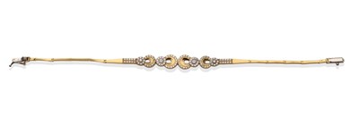 Lot 2095 - A Diamond Set Bracelet, the centre section with four yellow graduated crescent shaped links,...