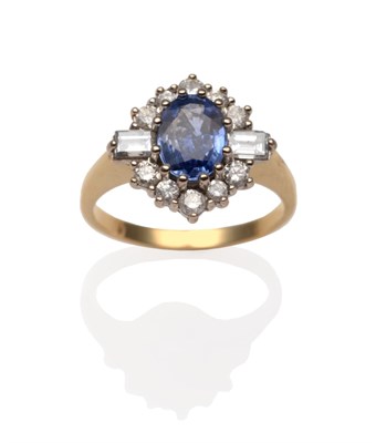 Lot 2096 - A Sapphire and Diamond Cluster Ring, an oval cut sapphire between two baguette cut diamonds and...