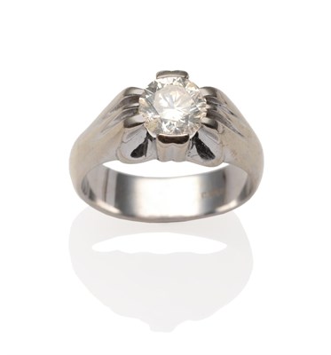 Lot 2098 - A Diamond Solitaire Ring, a round brilliant cut diamond in a white claw setting, to grooved...