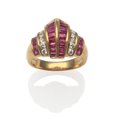 Lot 2101 - A Ruby and Diamond Ring, with columns of baguette cut and calibré cut rubies spaced by round...