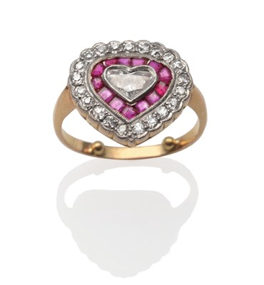 Lot 2102 - A Ruby and Diamond Heart Shaped Ring, a heart cut diamond in a white millegrain setting within...