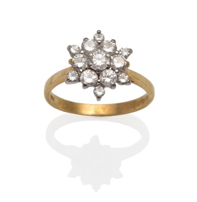 Lot 2107 - An 18 Carat Gold Diamond Cluster Ring, round brilliant cut diamonds in white claw settings on a...