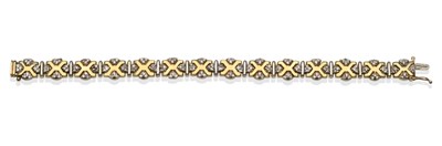 Lot 2134 - A Diamond Set Bracelet, formed of yellow x-pattern links with clusters of round brilliant cut...