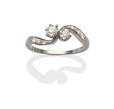 Lot 2140 - A Diamond Two Stone Twist Ring, two old cut diamonds in white claw settings, to eight-cut...