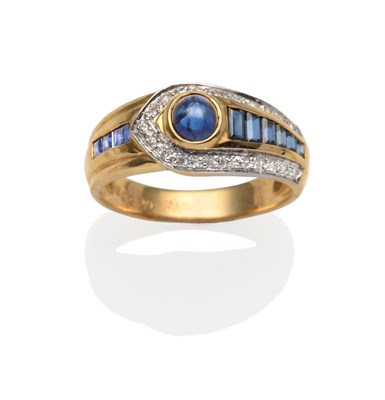 Lot 2143 - A Sapphire and Diamond Ring, a round sapphire cabochon in a yellow rubbed over setting flanked...