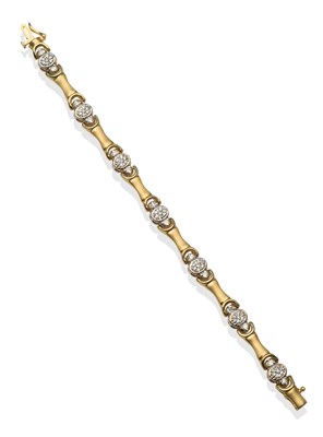 Lot 2150 - A Diamond Bracelet, oval white links pavé set with round brilliant cut diamonds and flanked by...