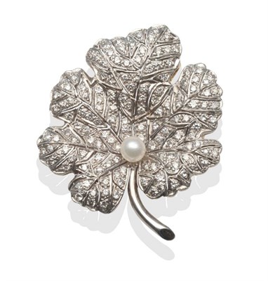 Lot 2154 - A Diamond and Pearl Leaf Brooch, pavé set with round brilliant cut and eight-cut diamonds with...