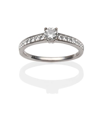 Lot 2170 - A Diamond Solitaire Ring, a round brilliant cut diamond in a white four claw setting, to pavé...