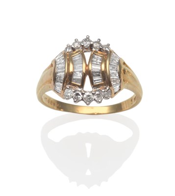 Lot 2182 - A Diamond Ring, with curved columns of baguette cut diamonds in yellow channel settings, flanked by