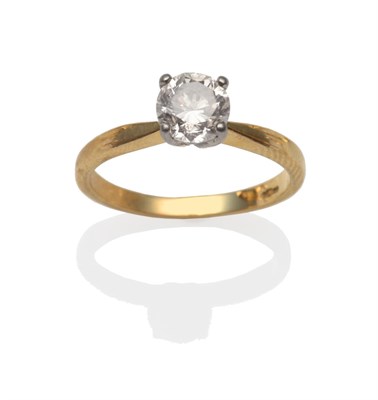 Lot 2183 - An 18 Carat Gold Diamond Solitaire Ring, the round brilliant cut diamond in a white four claw...