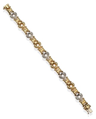 Lot 2185 - A Diamond Set Bracelet, white pavé diamond set pierced heart-shaped links spaced by yellow...