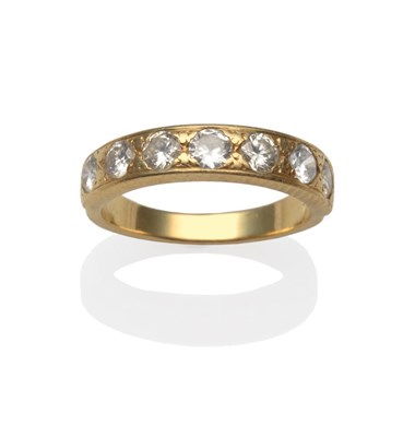 Lot 2188 - A Diamond Half Hoop Ring, seven round brilliant cut diamonds in yellow claw settings to a...