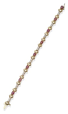 Lot 2199 - A Ruby and Diamond Bracelet, with oval cut rubies in yellow claw settings, flanked by...