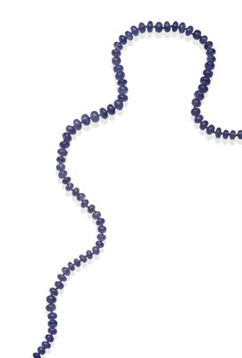 Lot 2210 - A Tanzanite Bead Necklace, of tumbled tanzanite beads knotted to a white ball clasp, length 54cm