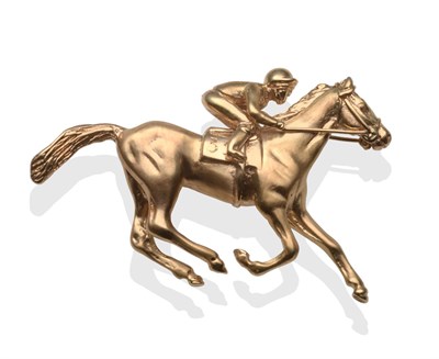 Lot 2215 - A 9 Carat Gold Horse and Jockey Brooch, by Rosemary Hetherington, realistically modelled with...