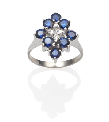 Lot 2221 - A Sapphire and Diamond Cluster Ring, four central eight-cut diamonds within a diamond shaped...