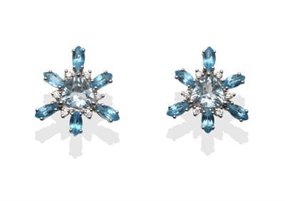 Lot 2222 - A Pair of Aquamarine, Blue Topaz and Diamond Cluster Earrings, a central triangular cut...