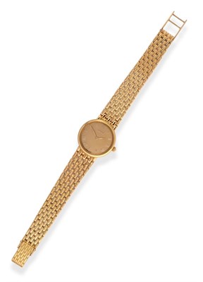 Lot 2234 - An 18ct Gold Wristwatch, signed Gucci, circa 1996, quartz movement, champagne coloured dial...