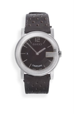 Lot 2265 - A Stainless Steel Day/Date Calendar Wristwatch, signed Gucci, model: 101M, circa 2005, quartz...