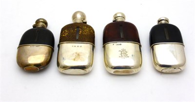 Lot 2282 - Four Victorian and Edwardian Silver Mounted Hip Flasks, various dates and makers, each with a...