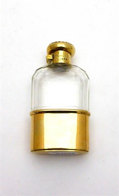 Lot 2285 - An Edwardian Silver Gilt Mounted Hip Flask, F & Co Ltd, London 1904, the cut glass body with a pull